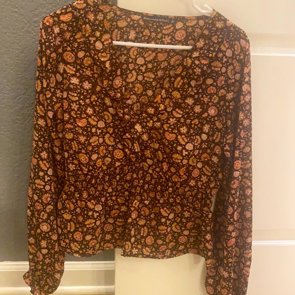 Sheer black floral smocked peplum top